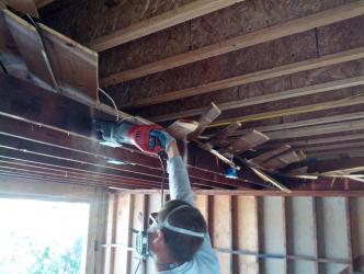 Removing the old roof structure.